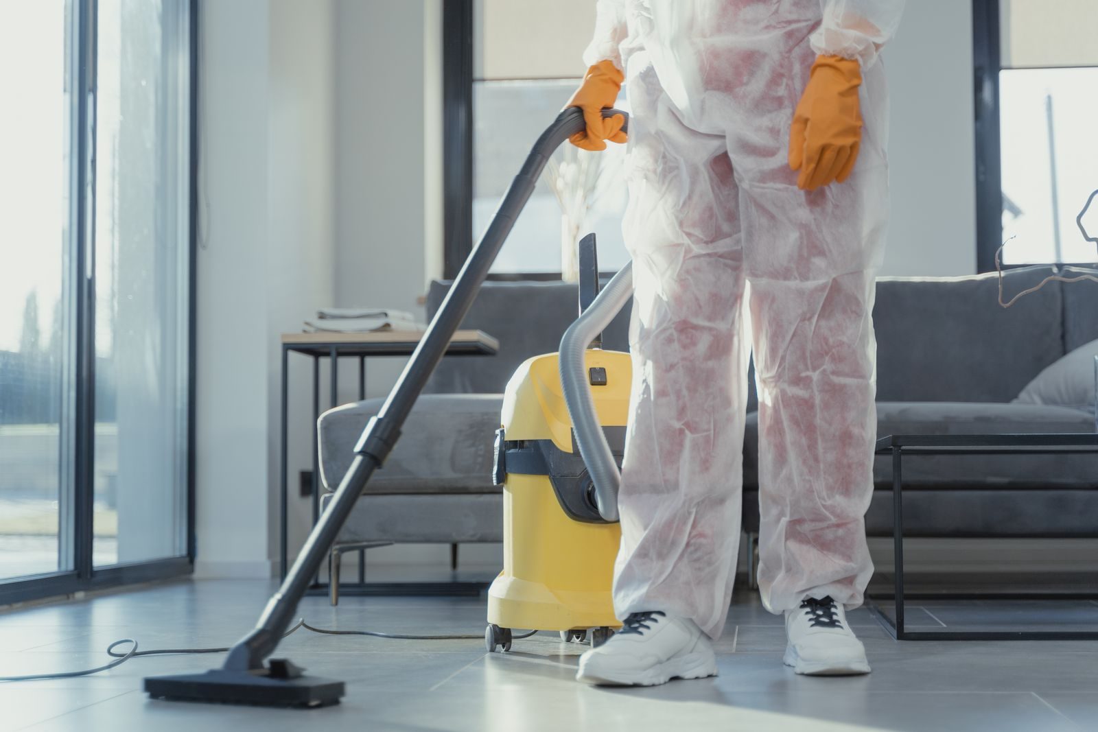Fishers water damage crew extracting water in a flooded living room